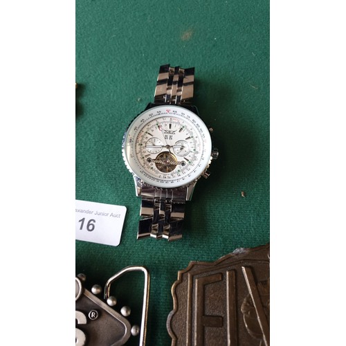16 - 2 Elvis belt buckles , gents jaguar watch and selection of medals.