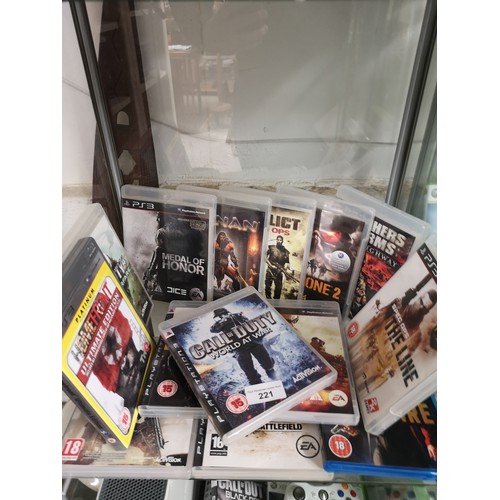 221 - Shelf of PlayStation 3 games.