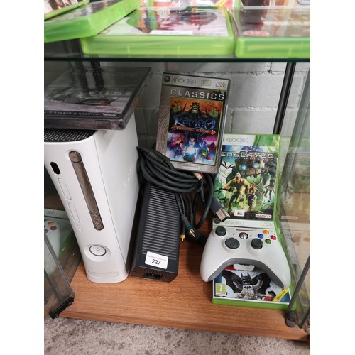 227 - Xbox 360 console power suply together with games and controller.