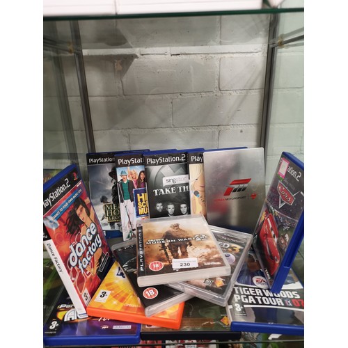 230 - Shelf of PlayStation 2 games.