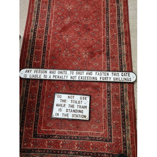 239 - Large cast iron sign together with other cast iron sign.