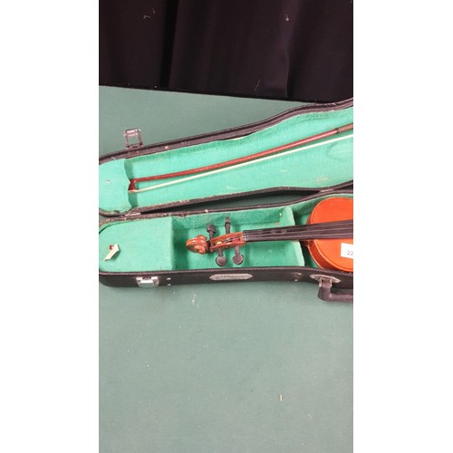 220a - Violin with bow in fitted case.