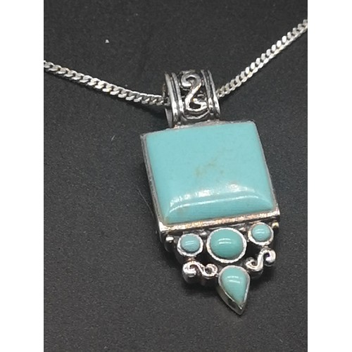 157 - Silver necklace set with Ornate Pendant in Turquoise stone.