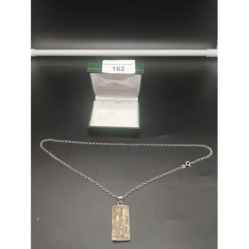 162 - Silver necklace set with mother of pearl burnt design pendant.