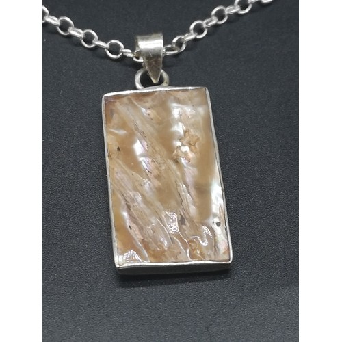 162 - Silver necklace set with mother of pearl burnt design pendant.