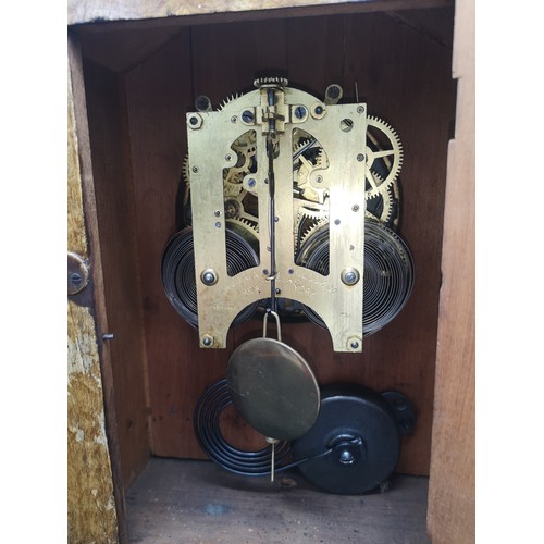 242 - Sonia clock Co New York USA light oak mantle dated 18th June 1882 with pendulum.
