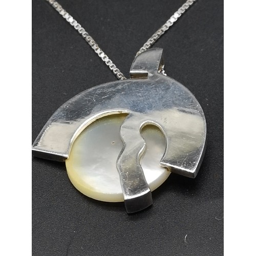 81a - Silver necklace set with unusual pendant.