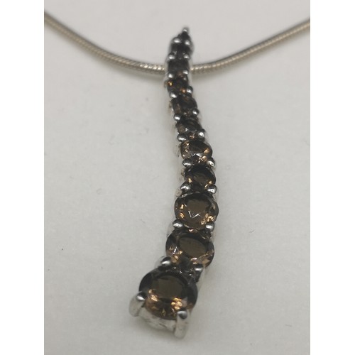 194 - Silver necklace set with smokey quartz design pendant.