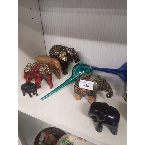 88a - Shelf of elephants etc.