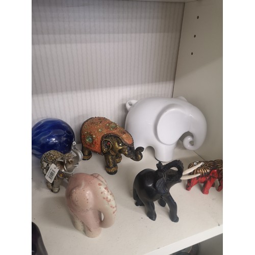 88a - Shelf of elephants etc.
