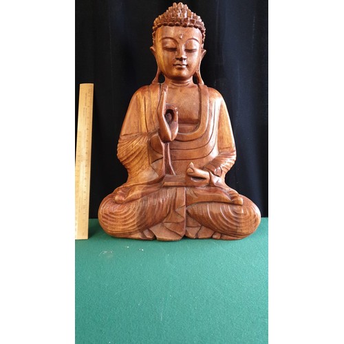 66 - Large Oriental carved wooden Buddha.