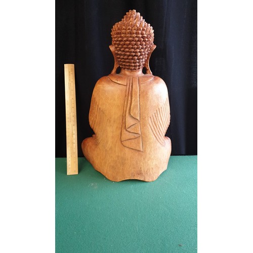 66 - Large Oriental carved wooden Buddha.