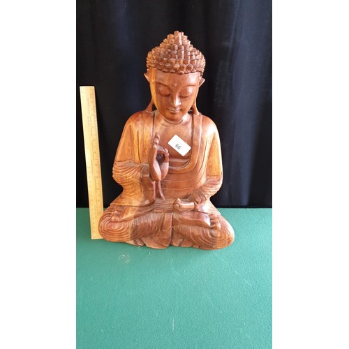 66 - Large Oriental carved wooden Buddha.