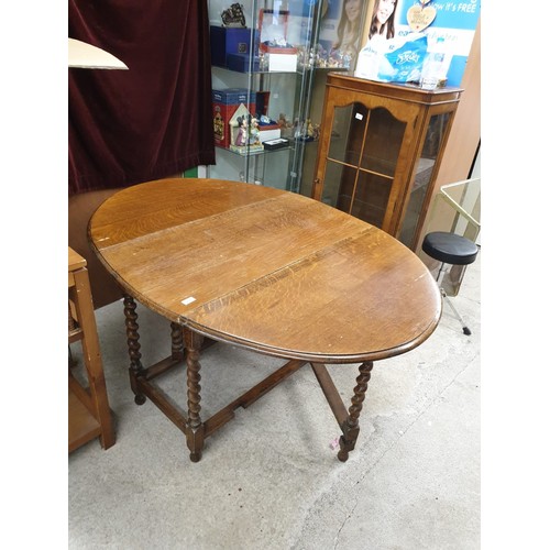 59 - Oak barley twist legged drop leaf table..
