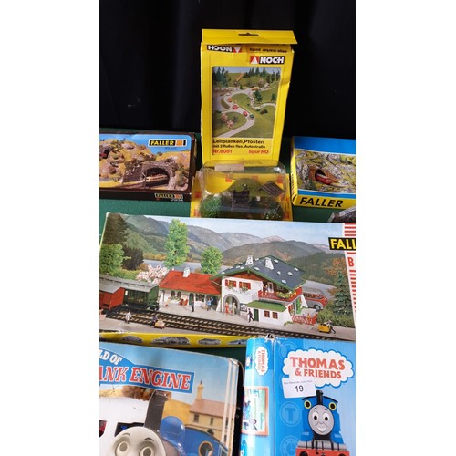 19 - Box of thomas the tank trains , oo guage scenery items boxes unchecked.