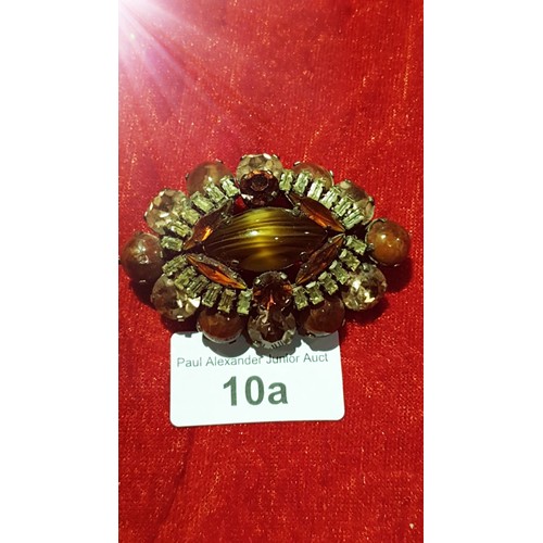 10a - Early large elaborate brooch With Tiger eye Centre with Amethyst and clear Stones Stunning.