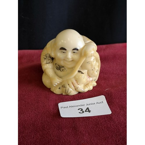 34 - Oriental monk Netsuke signed to base.