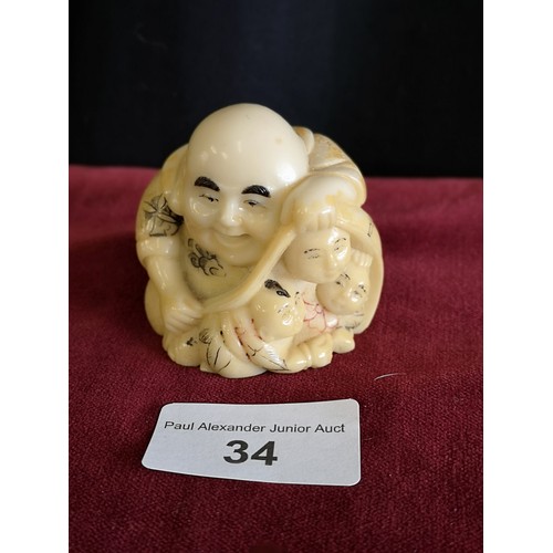 34 - Oriental monk Netsuke signed to base.