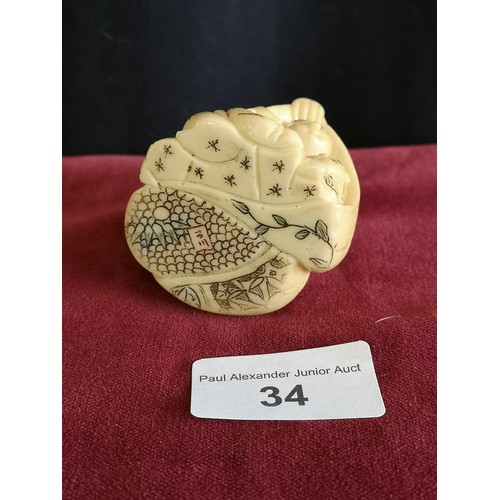 34 - Oriental monk Netsuke signed to base.
