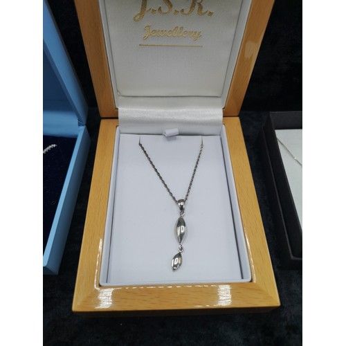 42a - Group of Silver necklaces with pendant s.