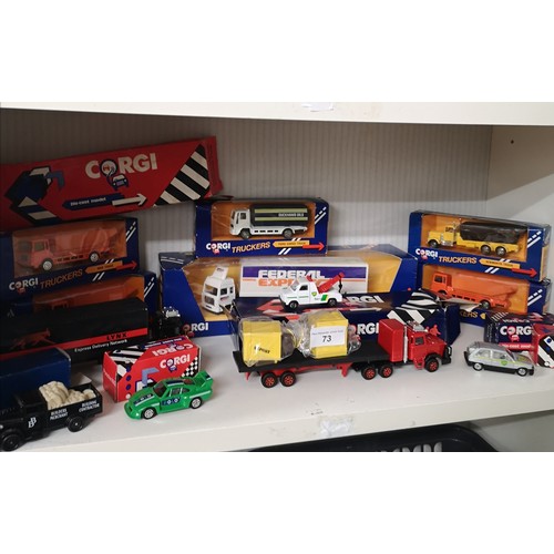 73 - Shelf of boxed corgi truck and cars etc.