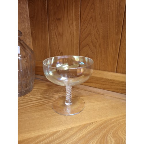 57 - Early 1900s faceted glass decanter together together with pair of unusual air stem glasses.