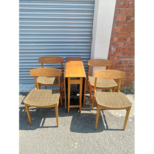 316 - Teak drop table with 6 chairs. no makers .