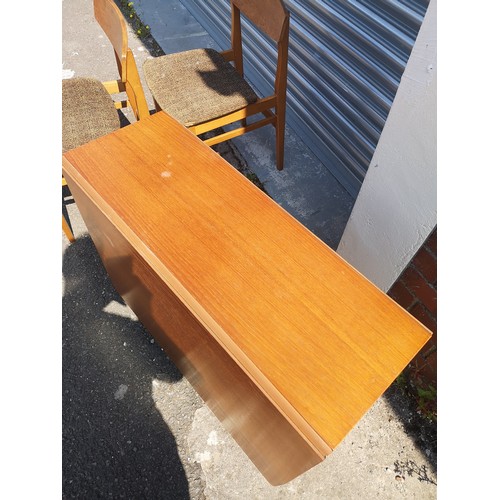 316 - Teak drop table with 6 chairs. no makers .