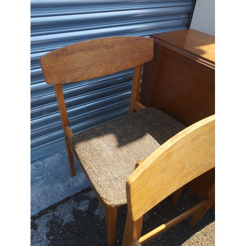 316 - Teak drop table with 6 chairs. no makers .