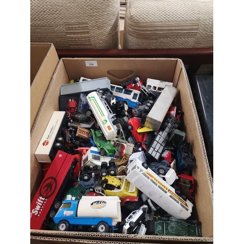 334 - Large box of plaworn vehicles .