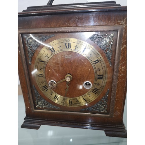 91 - Smiths Enfield mantle clock with pendulum and key .