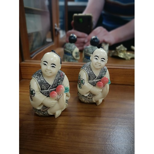 46 - Pair of oriental netsuke figures signed to base.