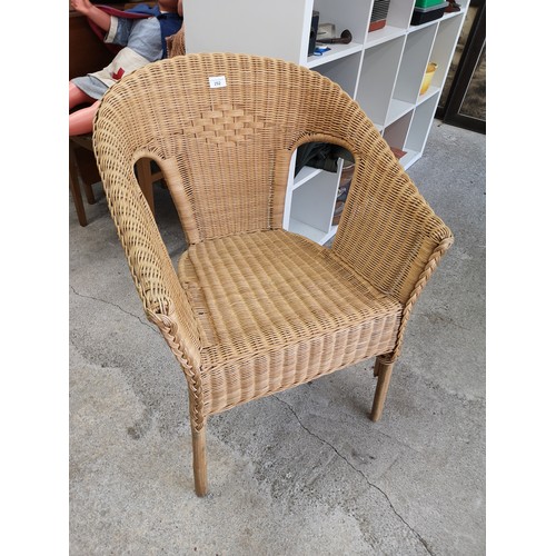 292 - Contempory wicker arm chair .