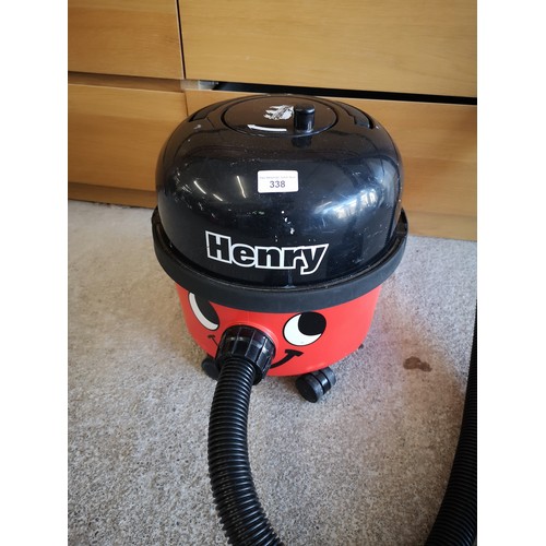 338 - Henry cylinder hoover with attachment.