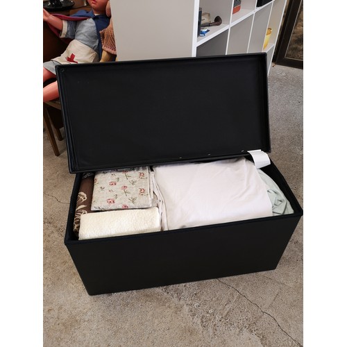 300b - Leather effect linen box containing linen.