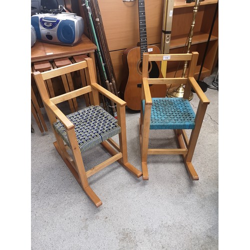 118 - Pair of Retro teak kids rocking chairs with rattan upholstery.