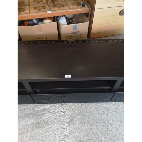 104 - Quality low tv unit with drawers.