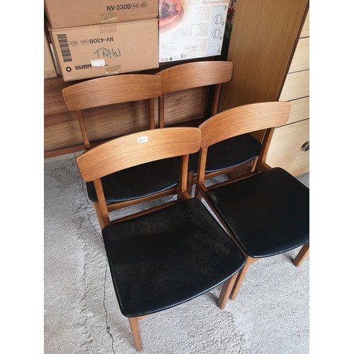 403 - Set of 4 Retro Teak chairs with black leather uphostery.