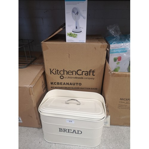 376 - Large box of new rotary bean slicers together with bread bin .