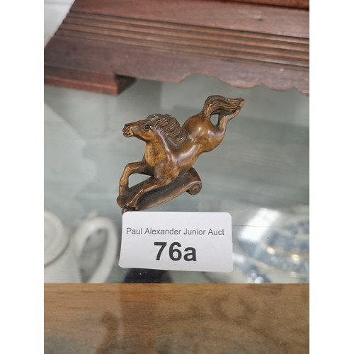 76a - Oriental horse netsuke signed to base.