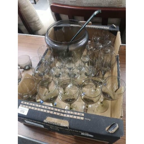 173 - Large lot of smoked glass punch set and large collection of glasses .