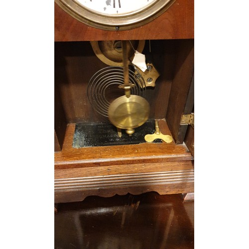 102 - Large American Gingerbread Mantel Clock with key And Pendulum stands 56 cms tall.