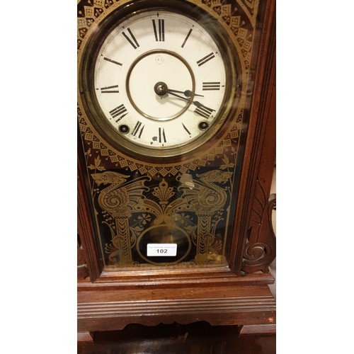 102 - Large American Gingerbread Mantel Clock with key And Pendulum stands 56 cms tall.