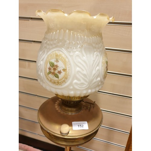 152 - Large antique brass oil lamp with lovely white glass shade .