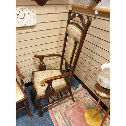 152a - Large antique arm chair with unusual design set with silk upholstery.