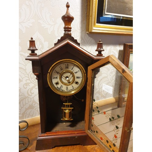 152c - Antique mantel clock with hand painted fronted glass and lovely designed 3 section top.