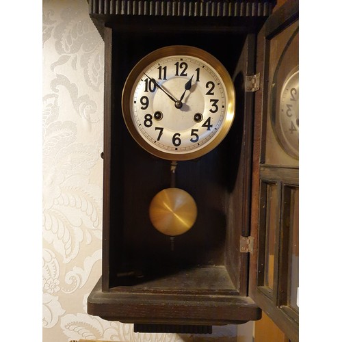 157 - Art Deco wall clock with pendulum.