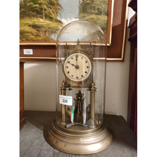 226 - 1900s Brass dome clock with glass dome .