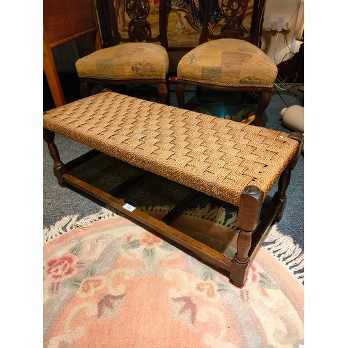 211 - Beautiful example of a long double section Scottish rattan topped stool .