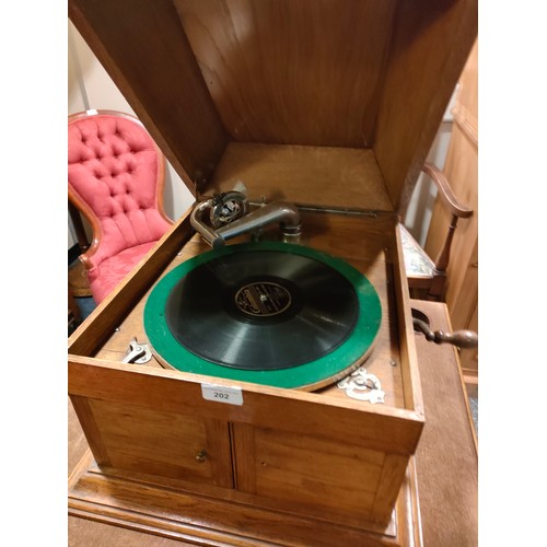 202 - 1900S Early oak Gramaphone complete with records and still plays .